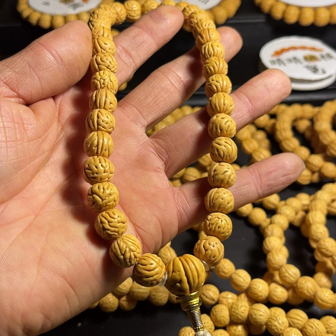 刘***辉桃核手串脖挂桃核