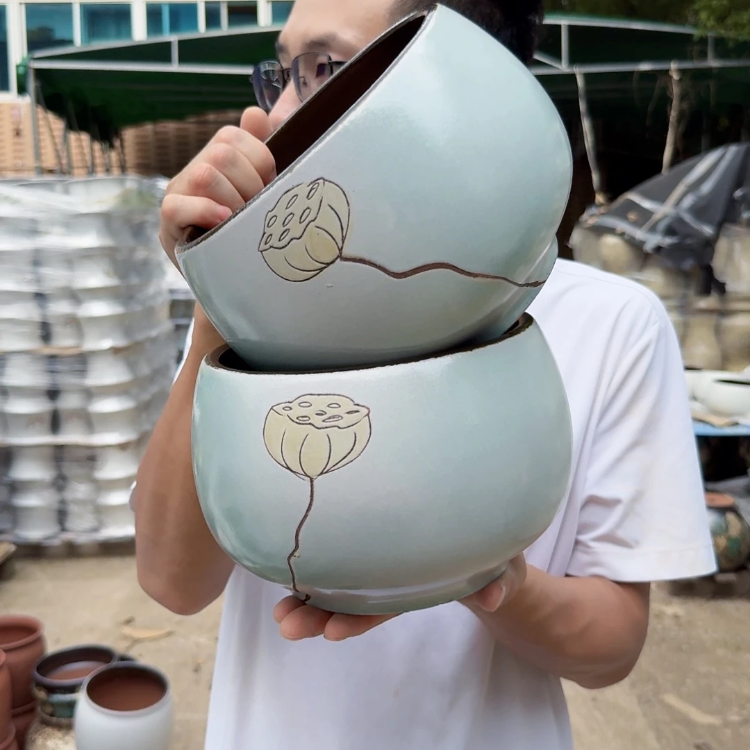 紫砂花盆口19高15（两个青色拼刻绘