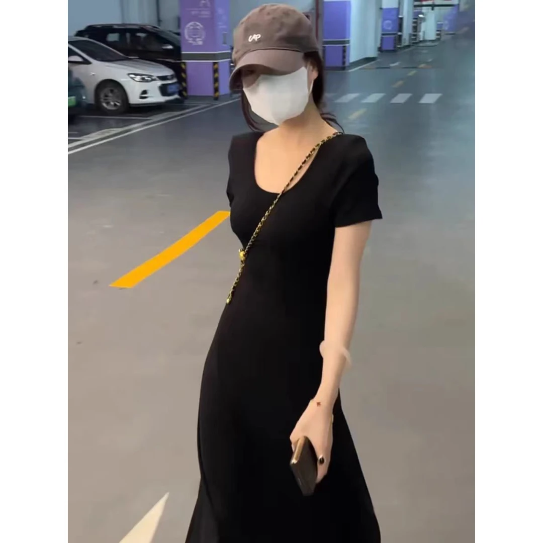 黑色短袖连衣裙女2025夏季新款镂空后背气质收腰显瘦中长款字裙