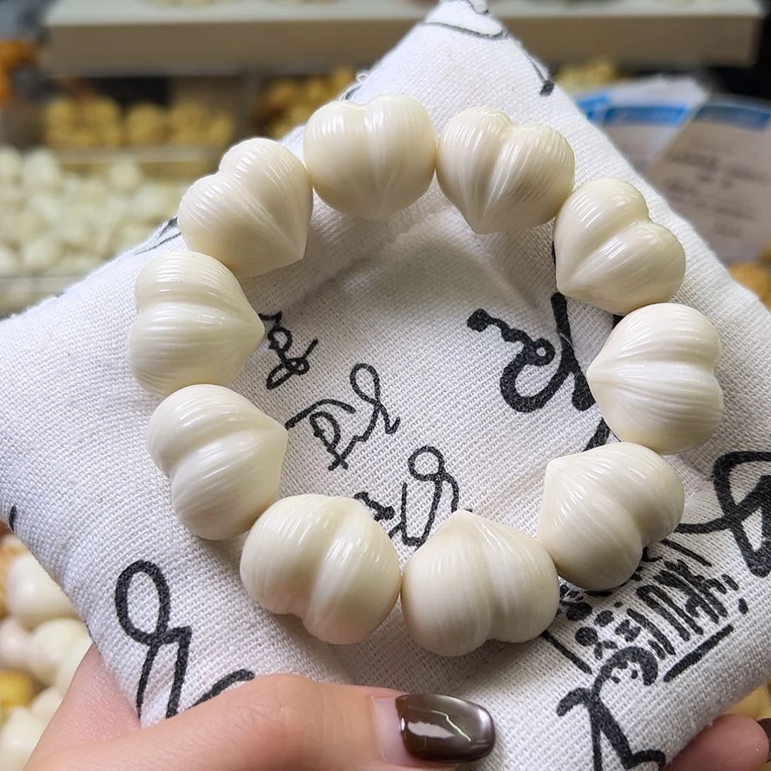 菩提根/象牙果手串微瑕拉丝屁桃一串