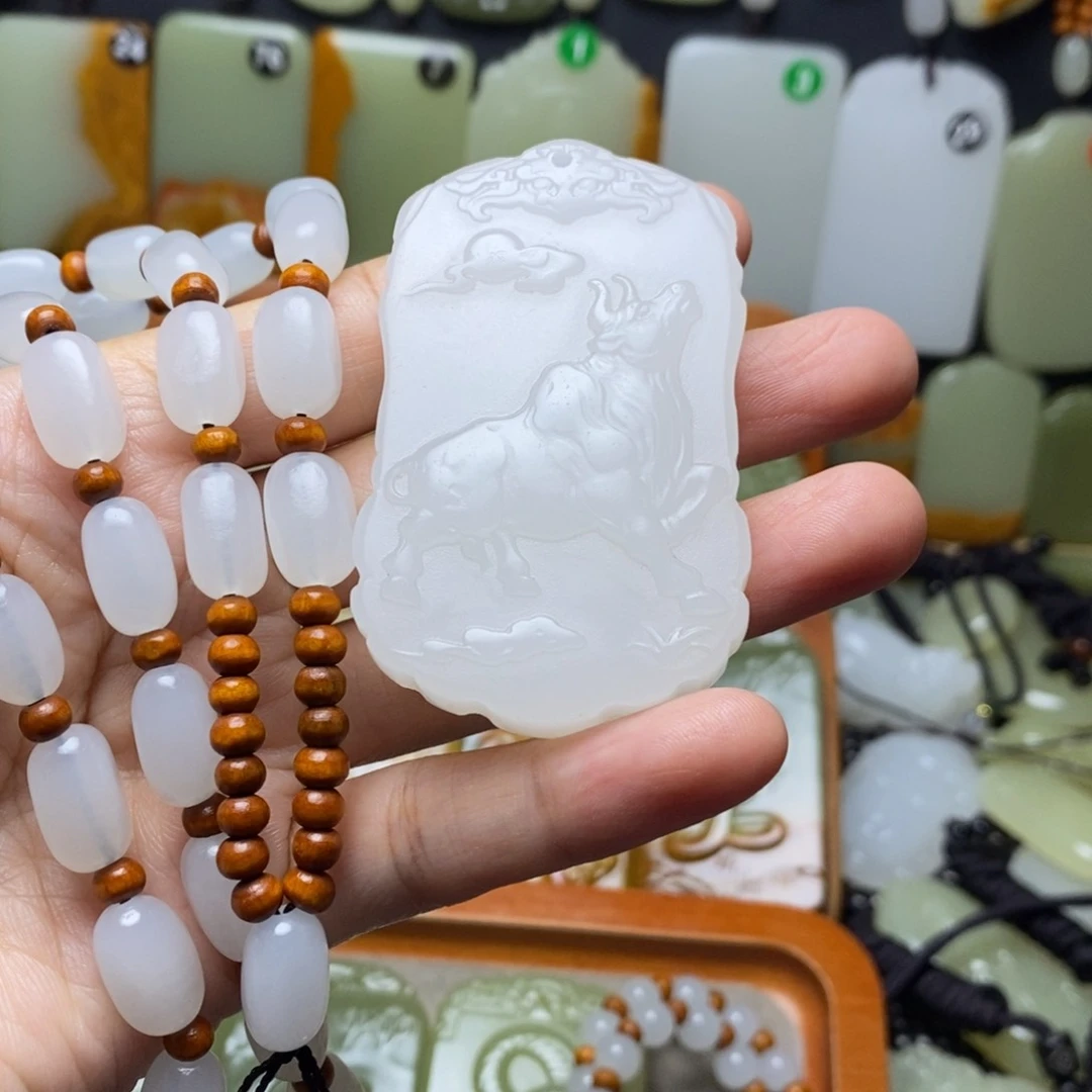 ?****新疆昆仑山料牛生肖牌子