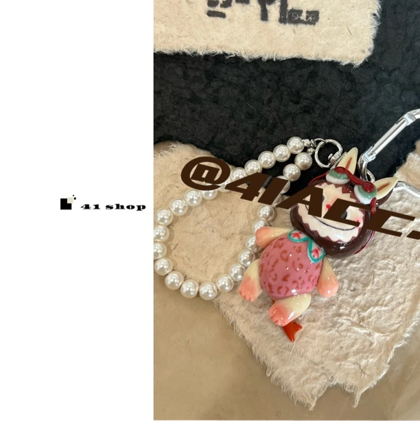 粉色布宝宝恐龙尾巴钥匙扣