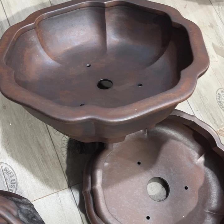 王***景紫砂花盆宜兴紫砂工艺厂。