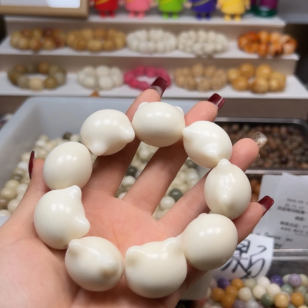 手串菩提根/象牙果微瑕白猫头9颗有裂