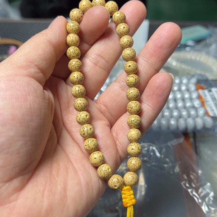 星月菩提手串正圆鸡油黄0.9左右手持0115号