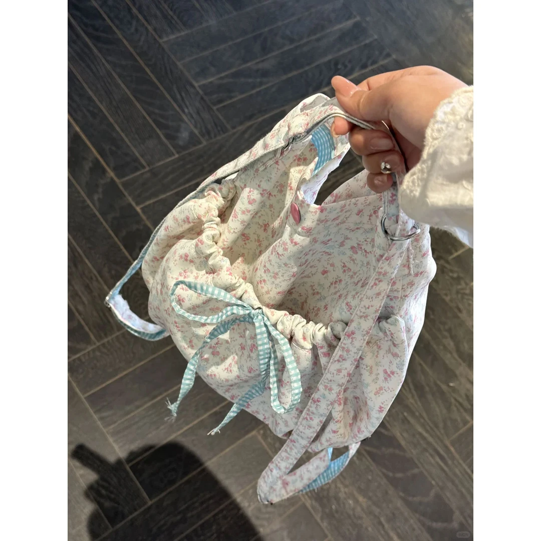 韩系一包多背碎花双肩包包女2025蝴蝶结帆布水桶包小众单肩斜挎包