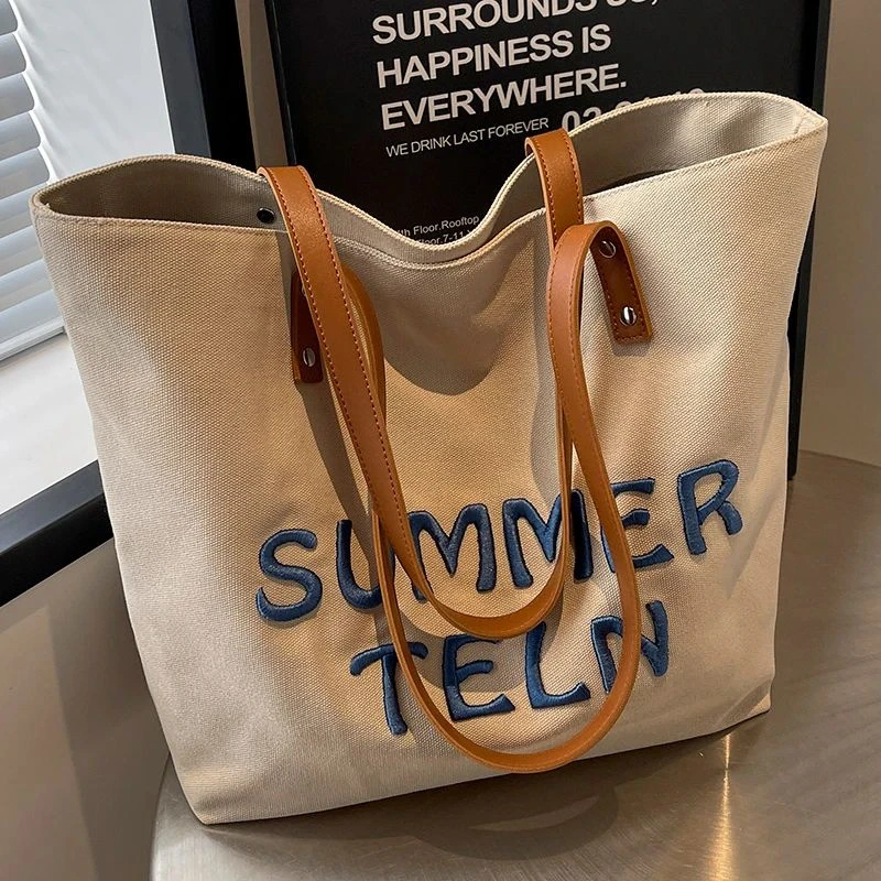 文艺小众时尚托特包女2025新款简约百搭大容量帆布包通勤单肩女包