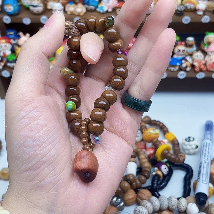 紫***然桃核吊坠库克大肠