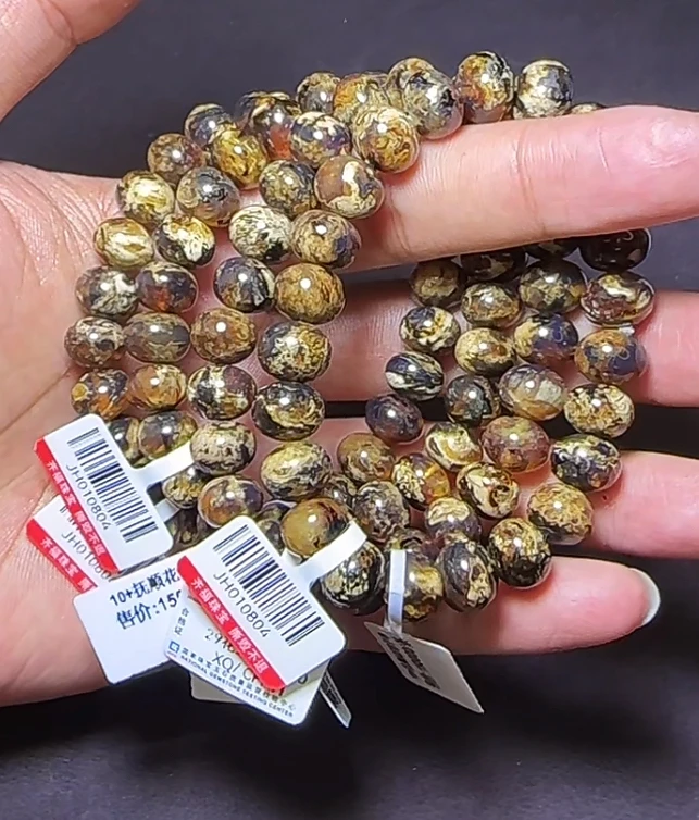 【齐福珠宝】FS04-29/10mm抚顺琥珀特级干白花手串(多样性发其一）