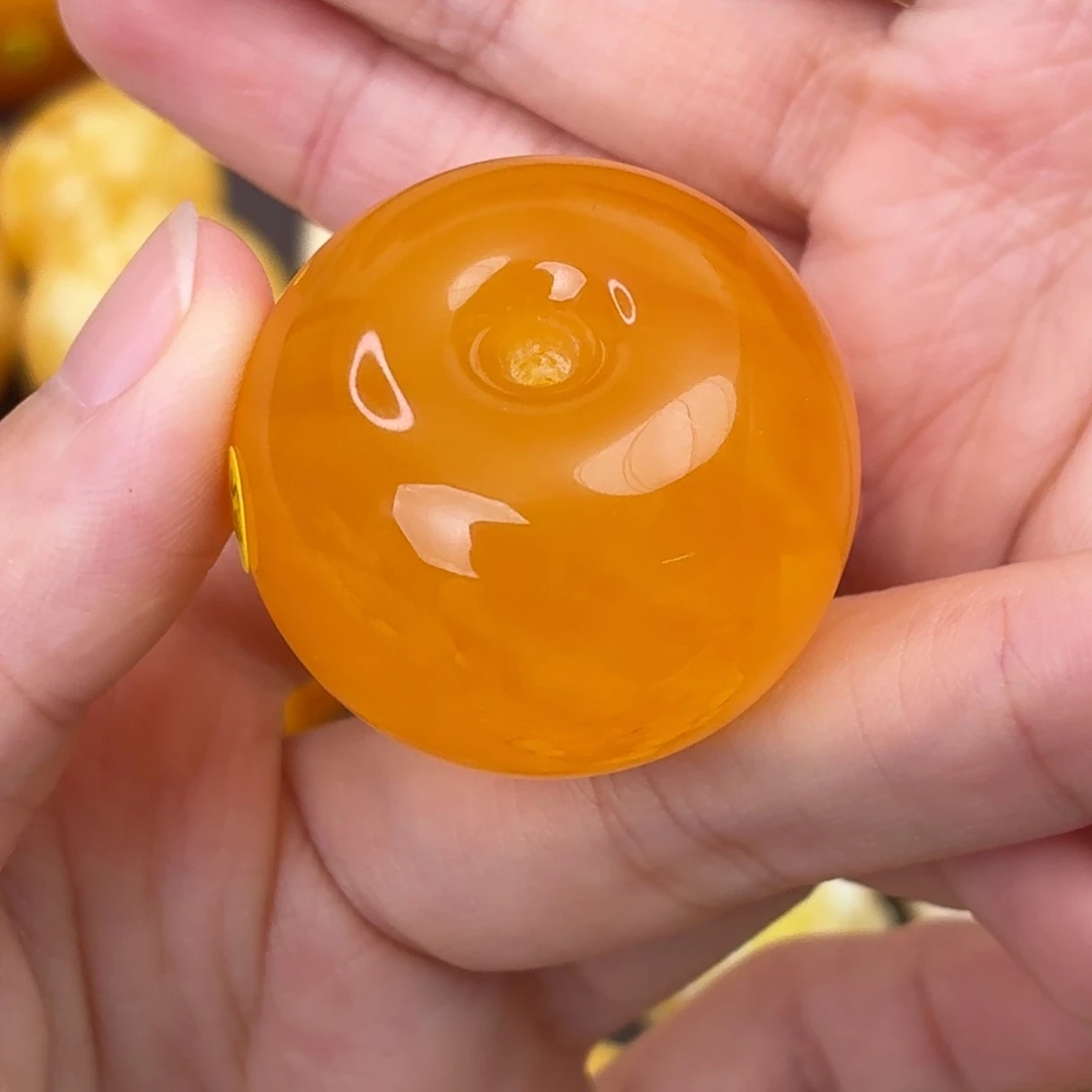 罗***粉琥珀未镶嵌裸石橘红墩子