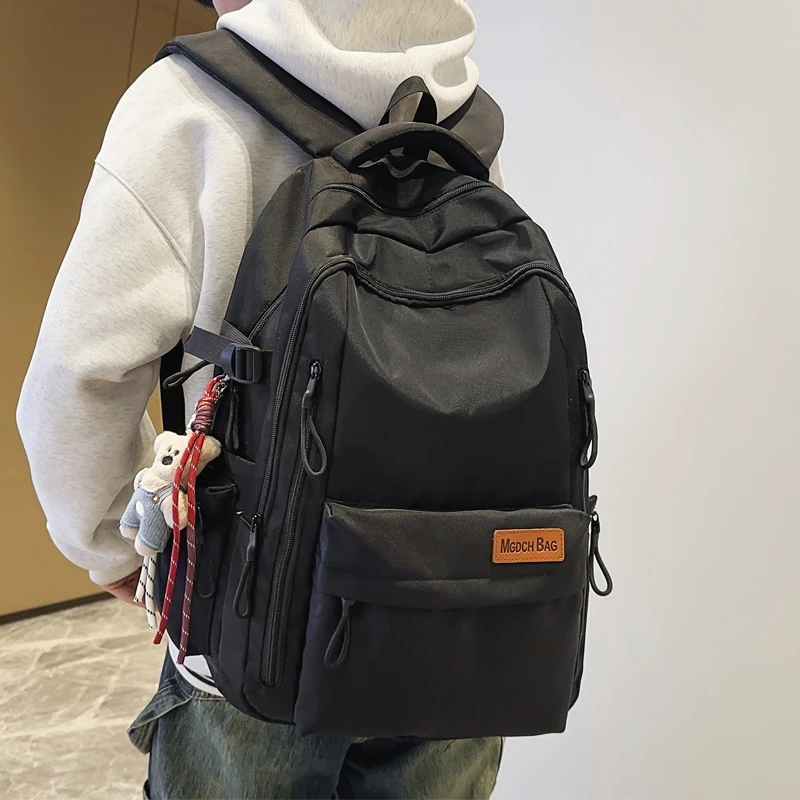 减负书包男生初中生简约百搭高中生大容量双肩包女大学生旅游背包