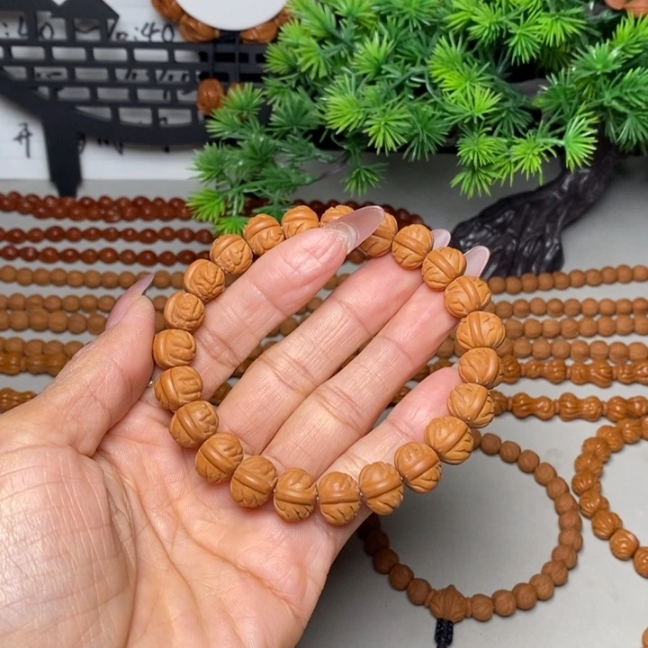 桃核手串凤羽聚宝盆