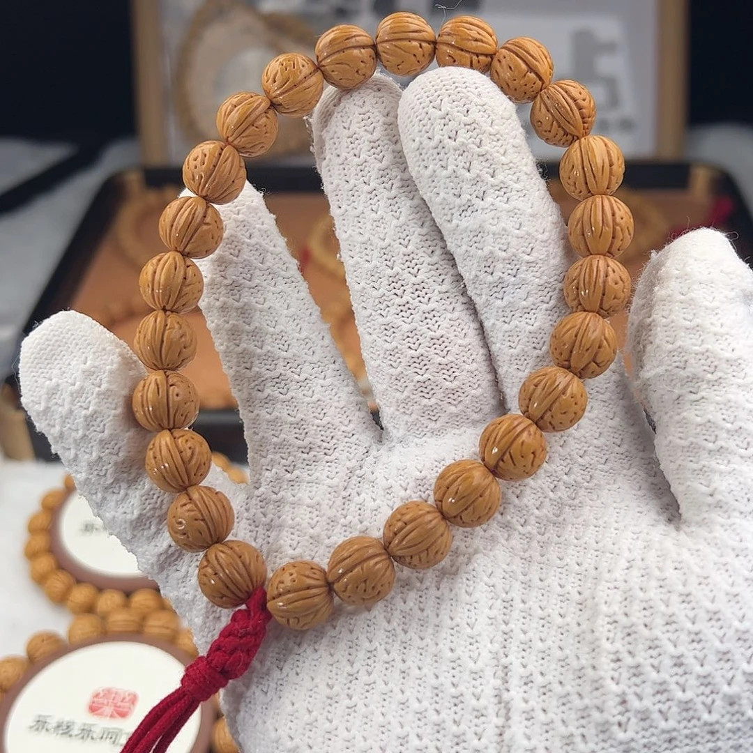 辛***闹桃核手串1.2「黄金瞳」野生桃核手持