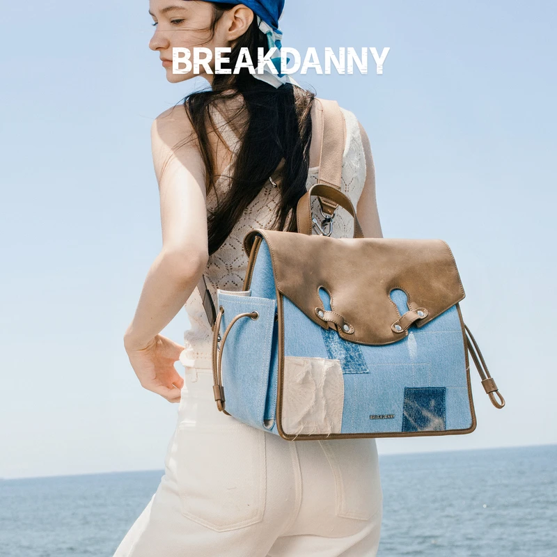 BREAKDANNY打破丹宁2025新款牛仔流浪双肩包牛皮复古休闲包