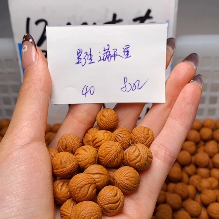 胖***子手串桃核12mm左右野生满天星40颗（打孔）
