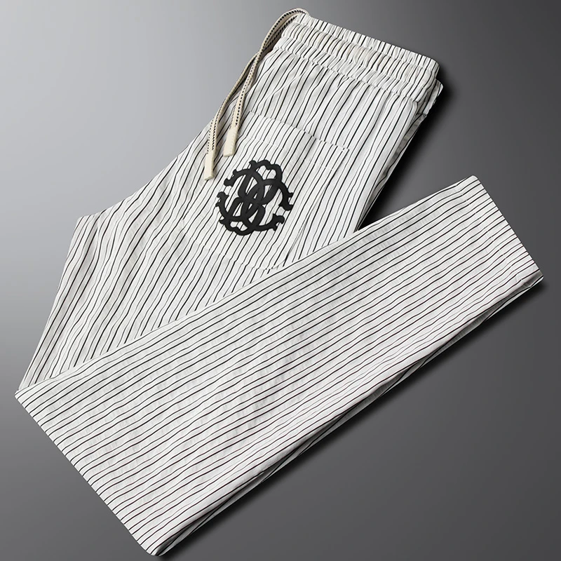 轻奢高端泡泡纱条纹休闲裤男士修身小直筒夏季薄款时尚冰丝运动裤