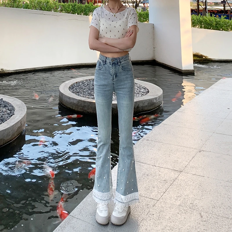 蕾丝拼接花边洋气微喇牛仔裤女九分春秋季新款显瘦钉珠喇叭裤子
