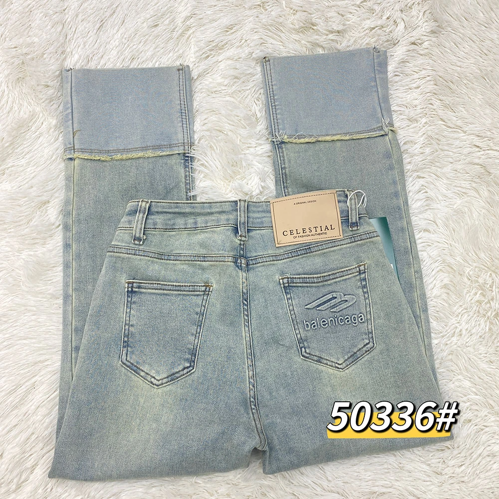 50336#春夏新款翡翠绿口袋钢印设计高弹牛仔裤拼接时尚法棍烟管裤