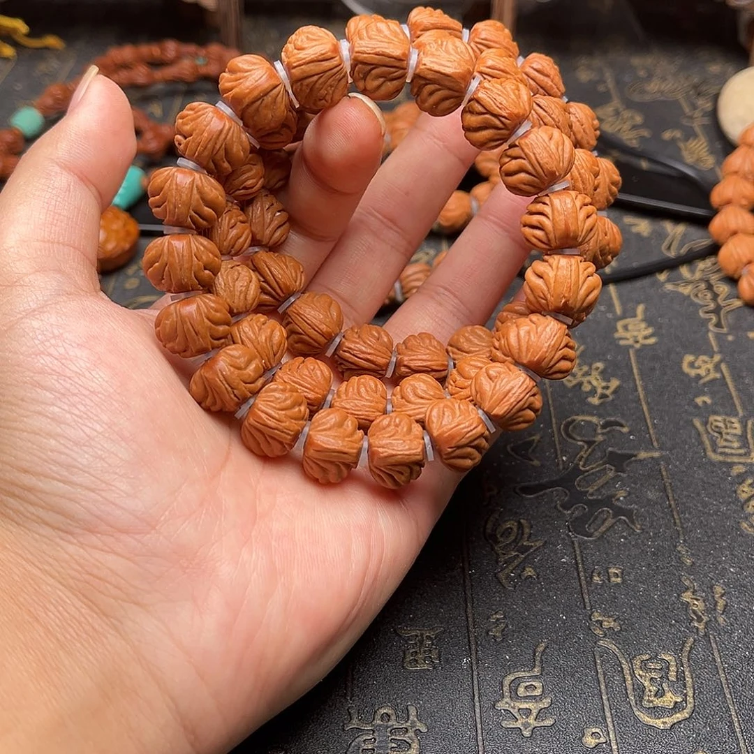 桃核吊坠双龙手串