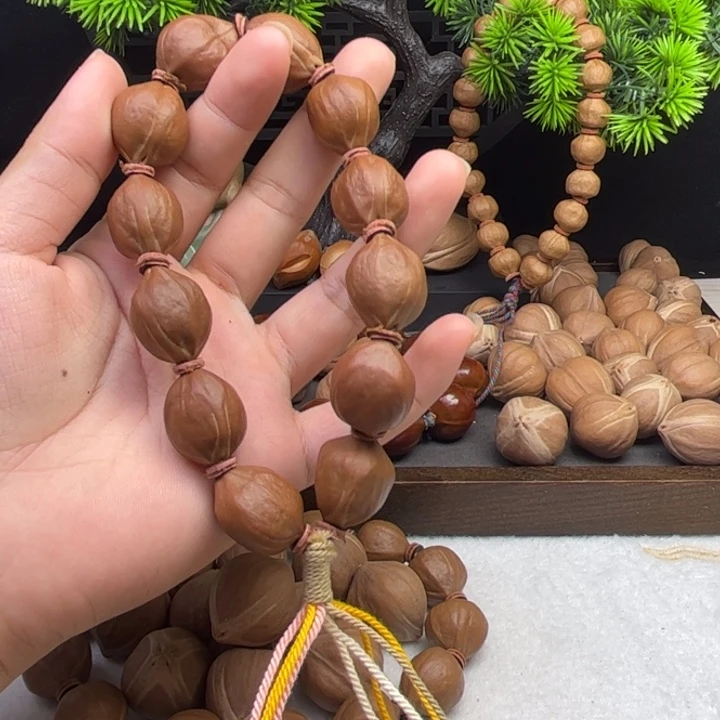 丁***铭手串/手链橄榄核1.6*2.1三花铁核