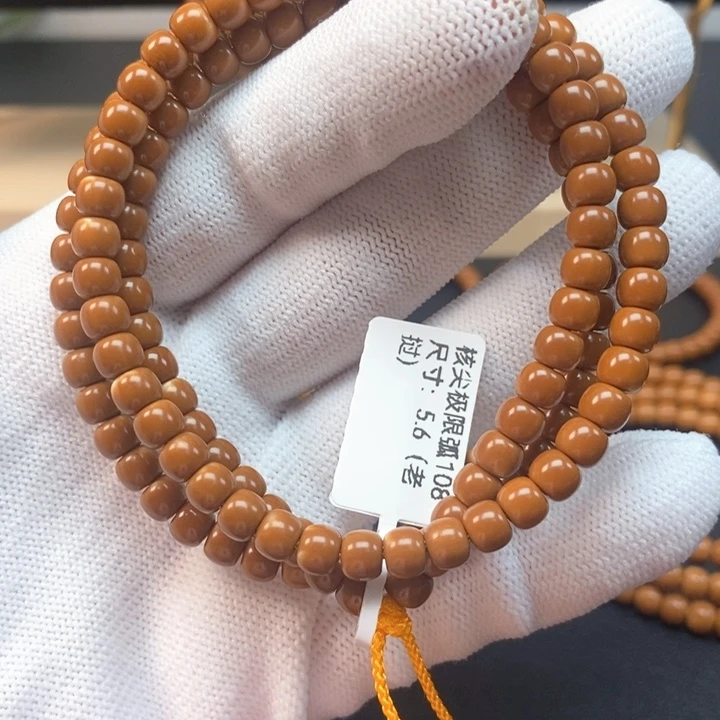 橄榄核手串5.6老挝核尖极限弧108微漏白