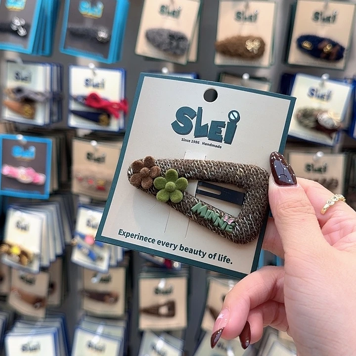 棕色三角毛线花掰掰