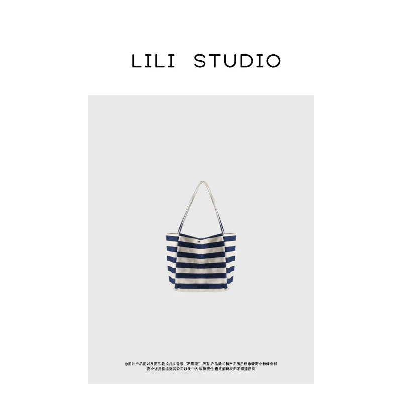 「条纹律韵」不理理春季新款时尚百搭小众休闲简约条纹单肩手提包女
