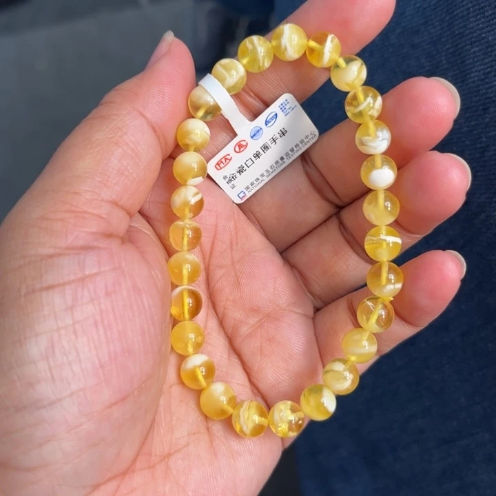 琥珀未镶嵌珠宝奇石M220号7.4+金瓷白妖花