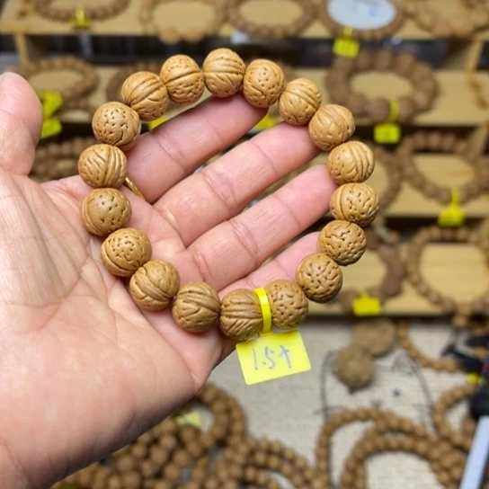 渑***售木质野生桃核手串