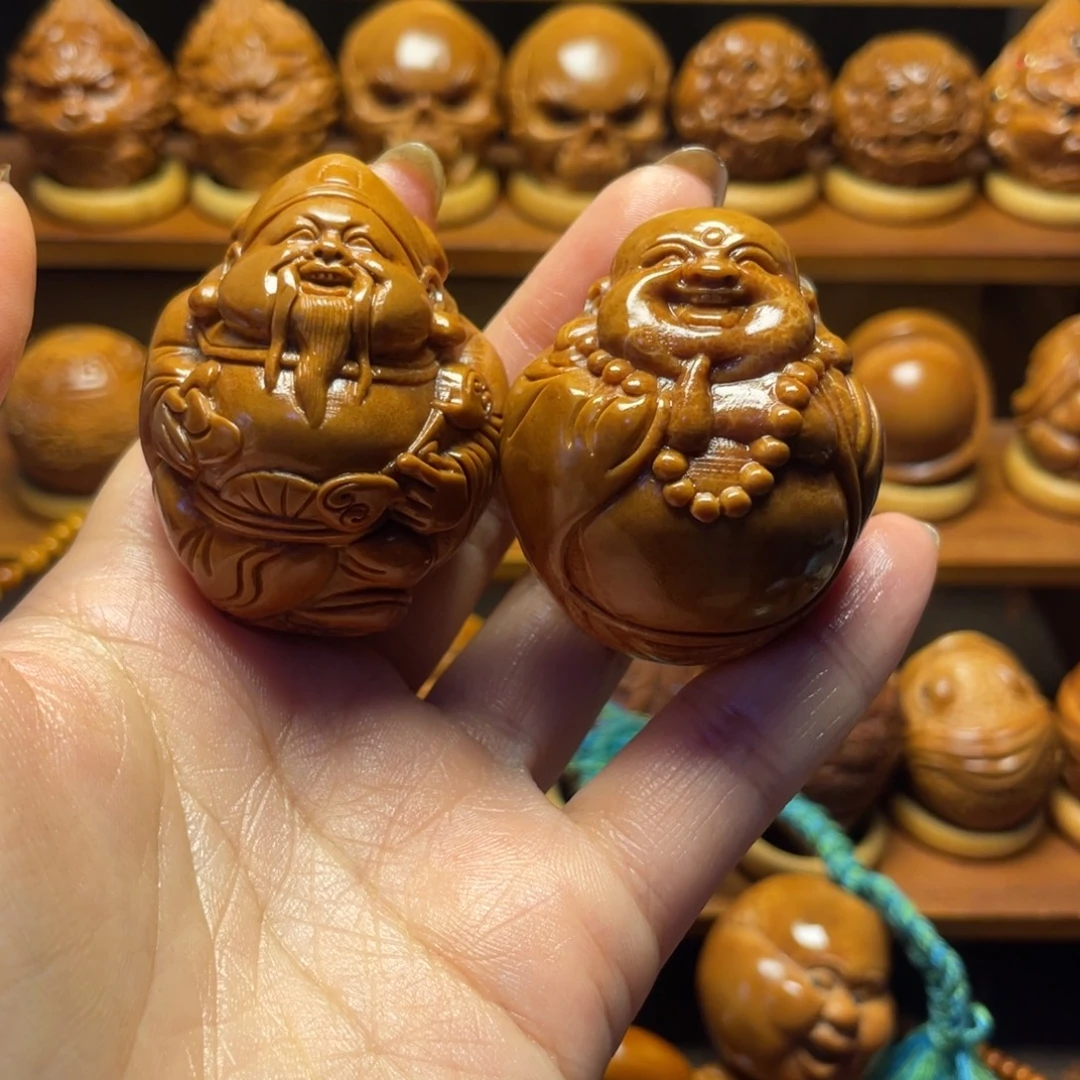 荣***哥橄榄核把件财弥一对