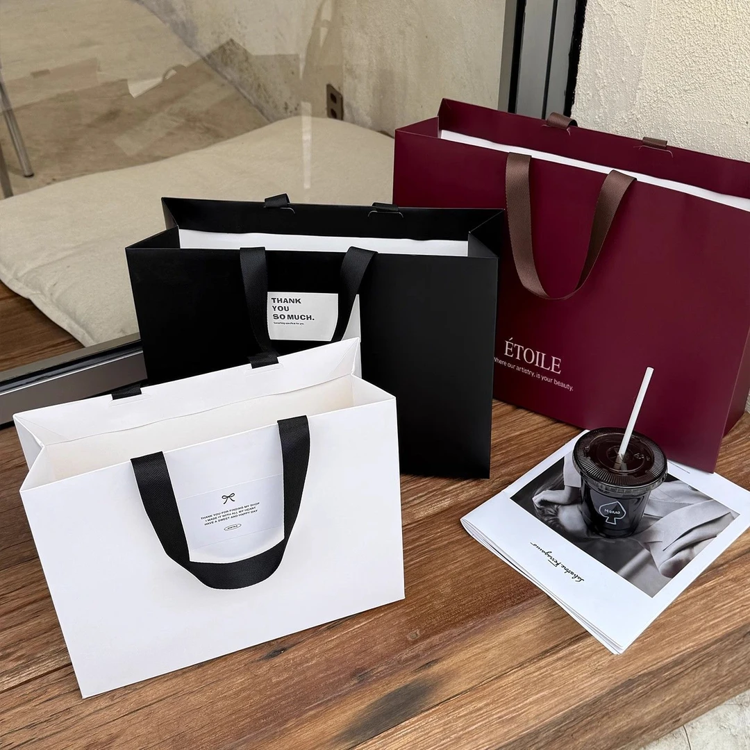 高定服装店纸袋购物女装衣服美容院包装带定制无纺布手提打包袋