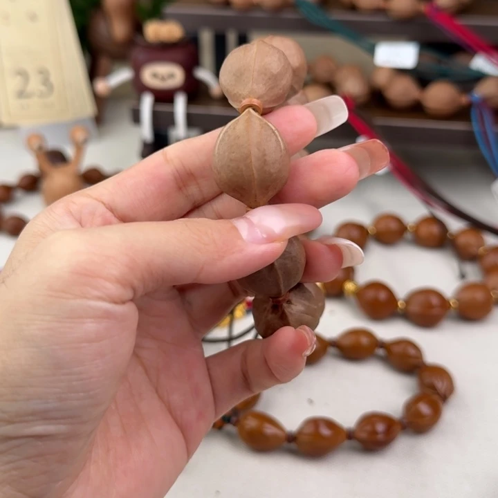 晞***.橄榄核手串21直径三通