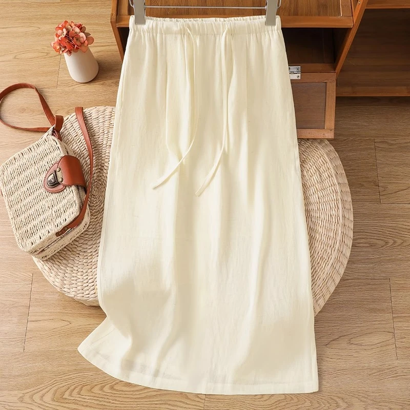 藏青色亚麻半身裙女夏季薄款2025新款超好看的a字裙棉麻直筒裙子