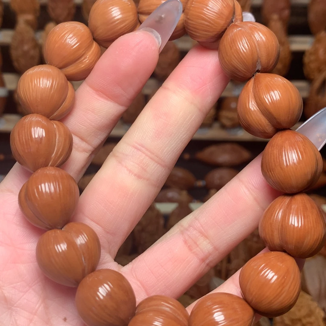 把件橄榄核猴头手串