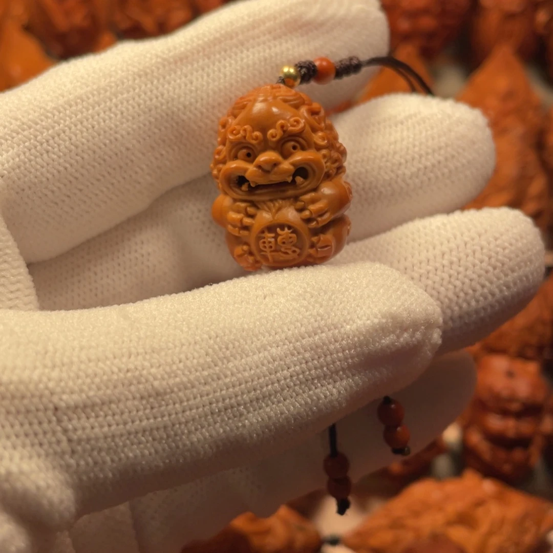 劉***波橄榄核手串/手链转运狮子