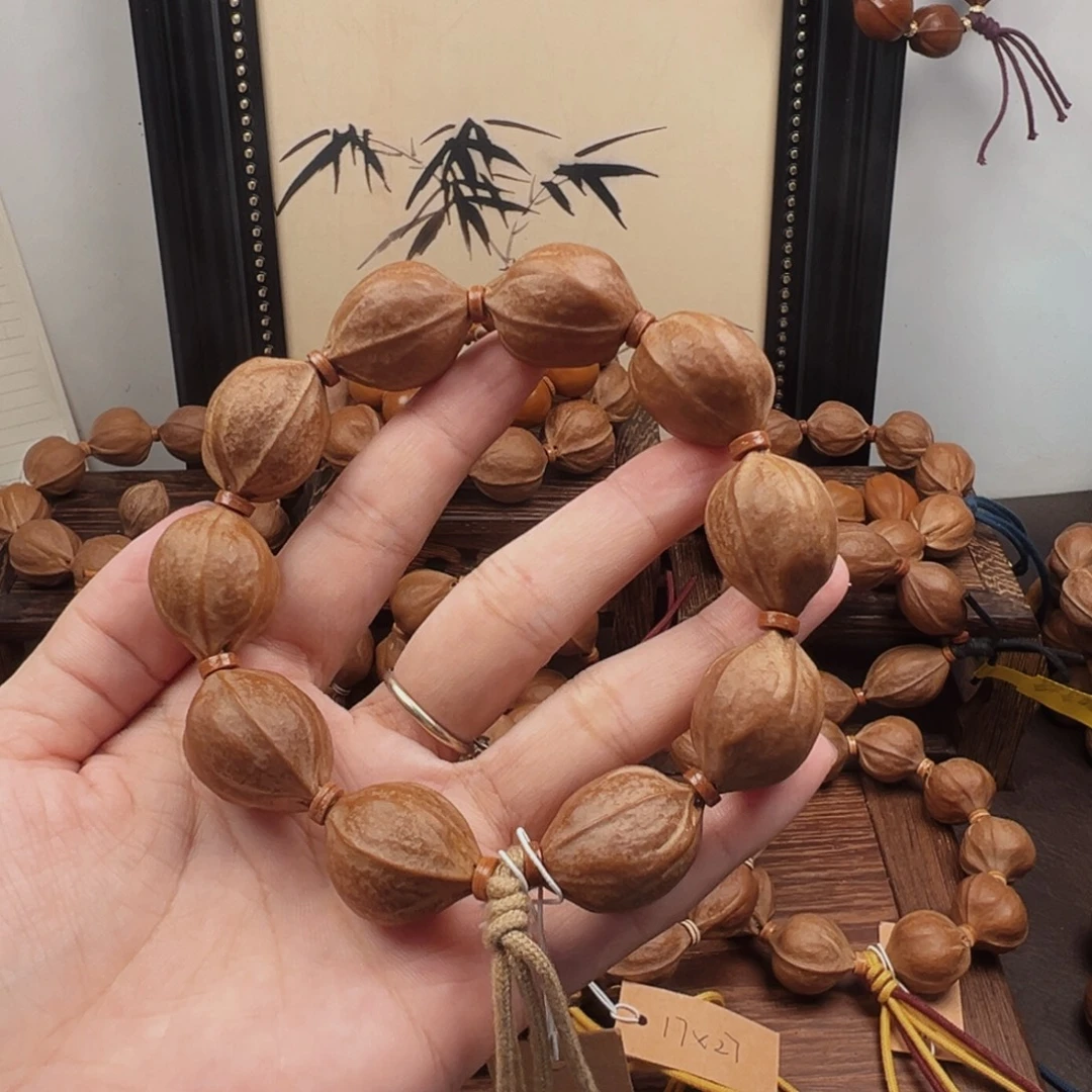 爱***筐手串橄榄核20.25梅林铁核