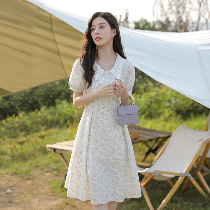 甜美初恋蕾丝碎花连衣裙女2025夏季轻奢娃娃领收腰遮肚中长款裙子