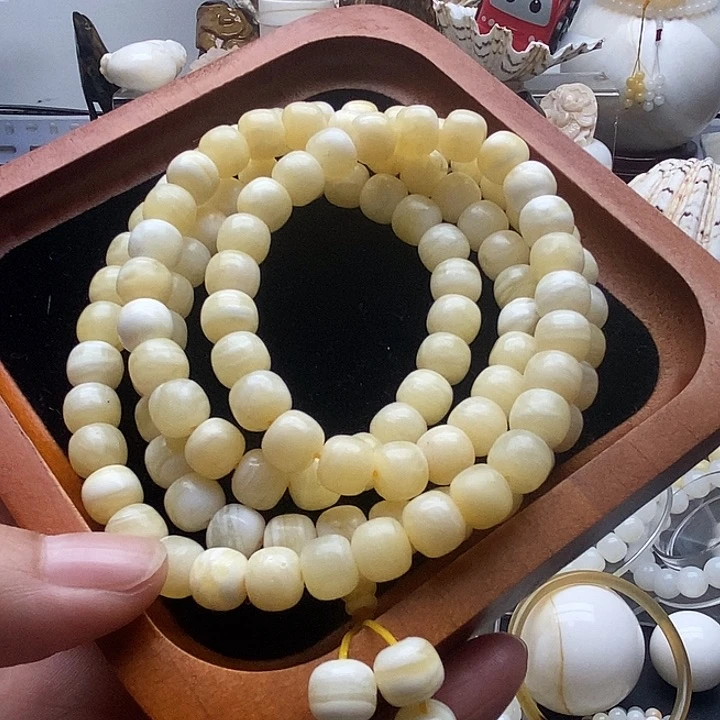 非金属贝壳蜜蜡色老型微瑕多圈