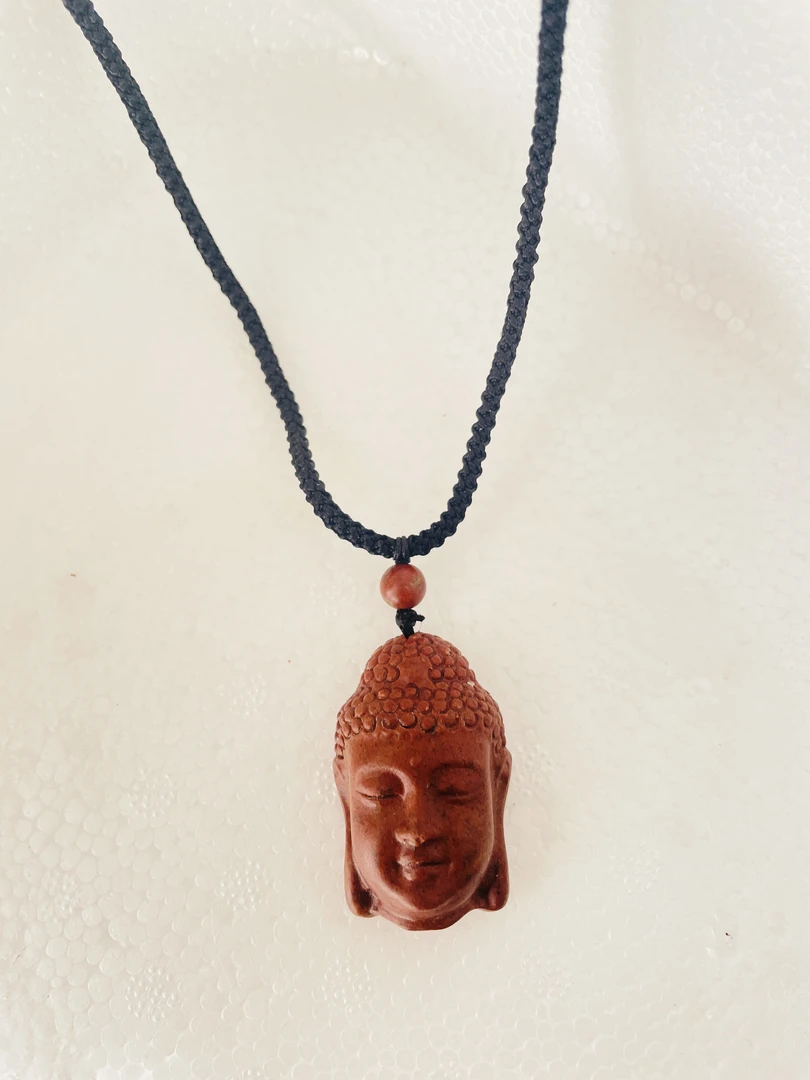 泗滨红砭石佛首精品