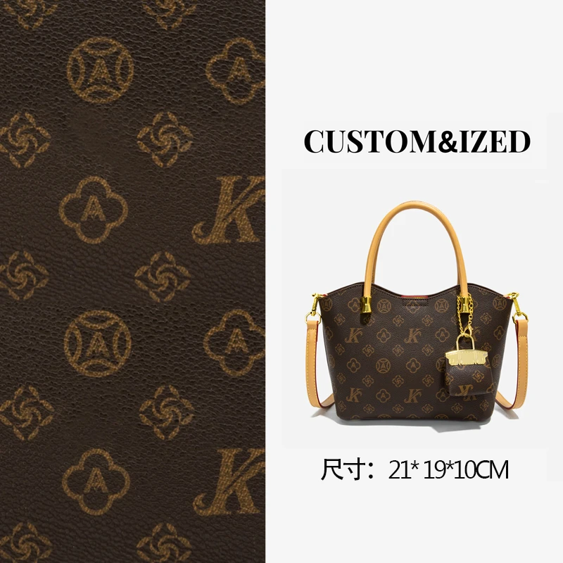 2023杏色秋冬新款经典印花网红大容量单肩斜挎饺子包棕色百搭