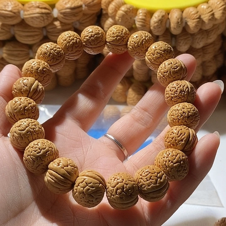 用***3桃核手串顺顺利利玲珑塔32