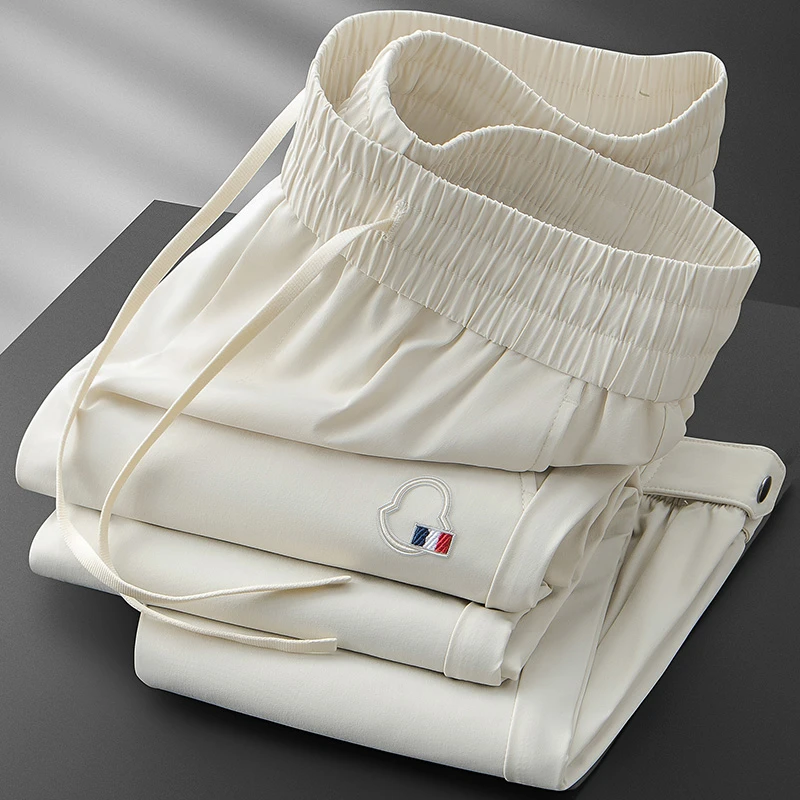 轻奢夏季薄款冰丝速干裤男小脚纽扣收口高端刺绣休闲卫裤男运动裤