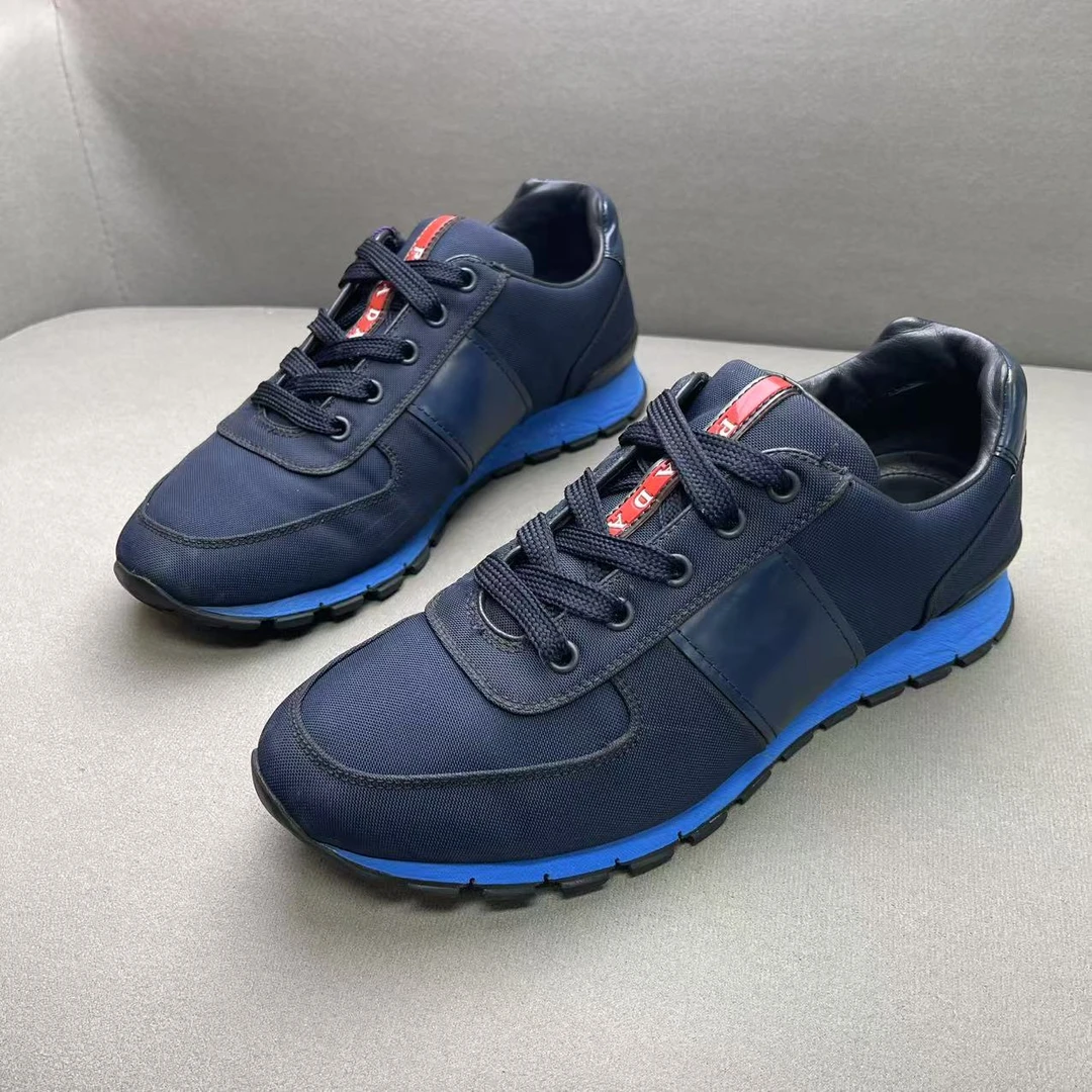 95新 Prada/普拉达 蓝色时尚百搭舒适编织网面红标运动鞋 40码