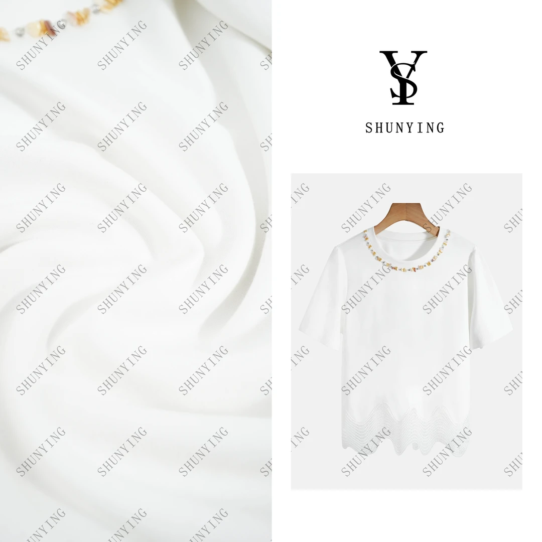 【仟娜】百搭舒适~时尚订珠简约纯色下摆拼接镂空短袖T恤SY72T25108