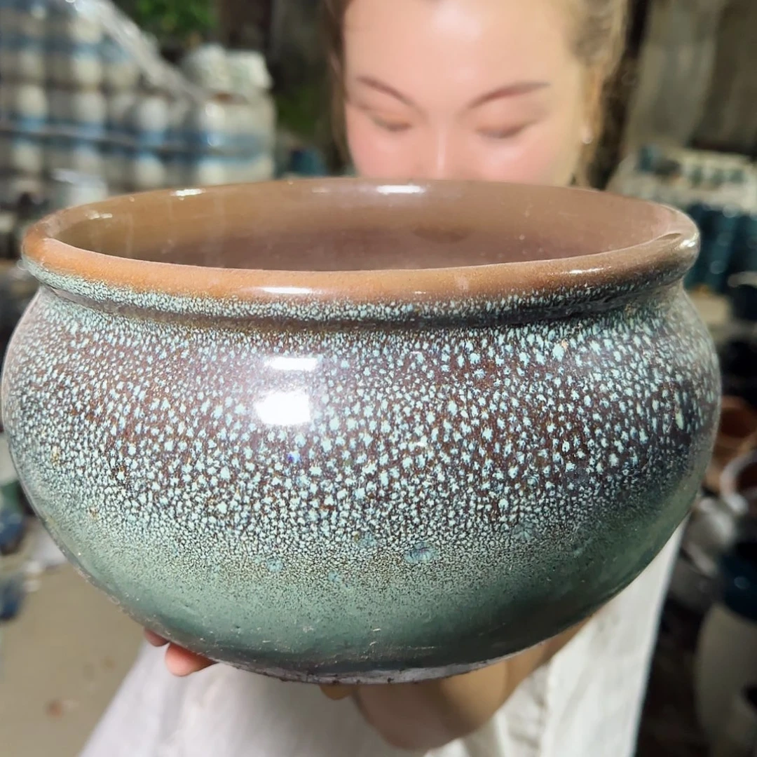 花盆紫砂高14口22。无孔