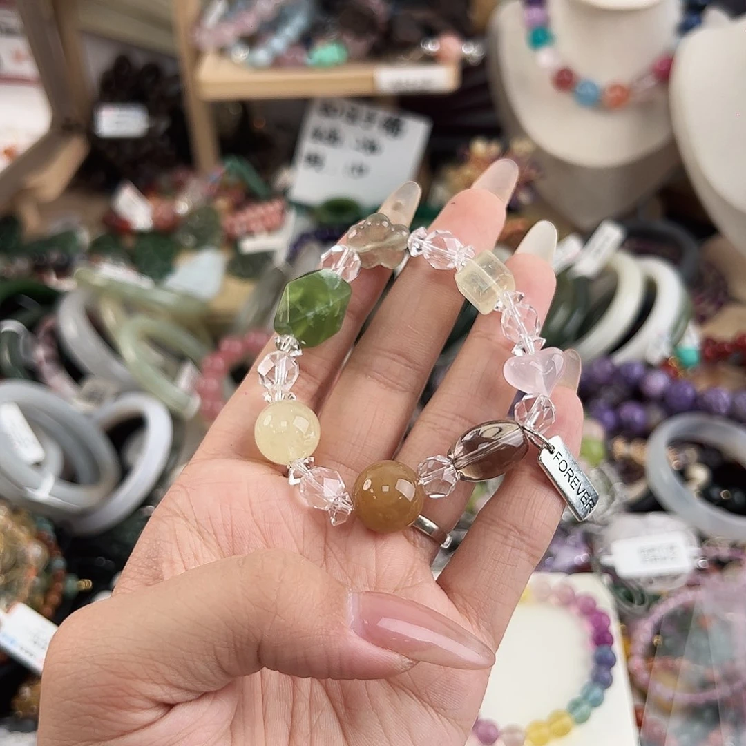 银S925镶嵌手链烟晶我****?