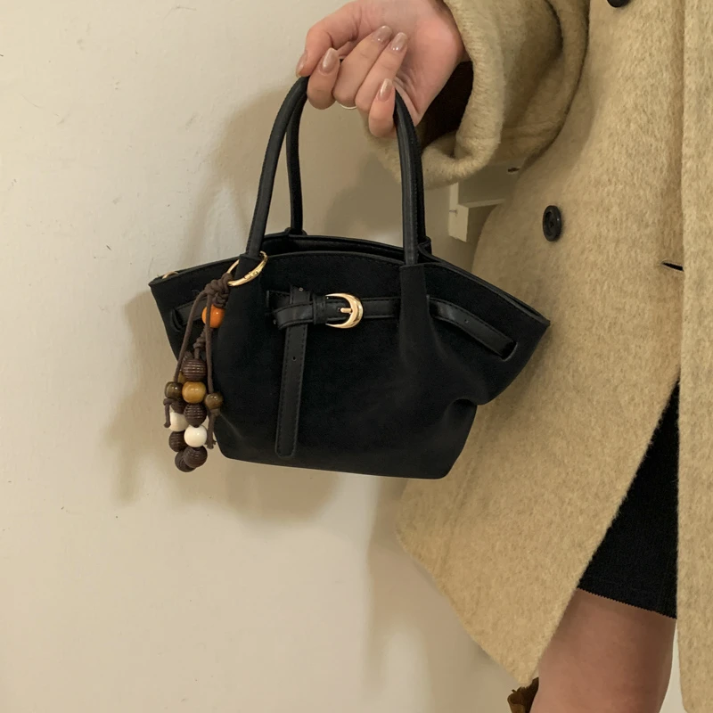 麂皮绒复古手提包包女2025新小众单肩包通勤斜挎包磨砂软皮云朵包