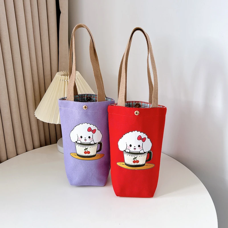 新款2025帆布包水桶包磁扣一体式耐磨简约风手提手拎包雨伞水杯包