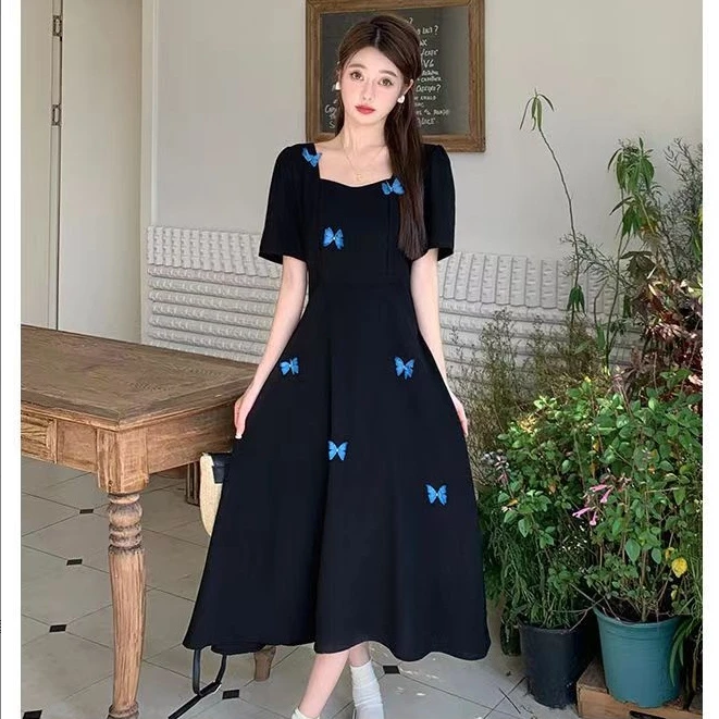 法式赫本风方领连衣裙女夏装2025新款蝴蝶结不规则小黑裙中长裙