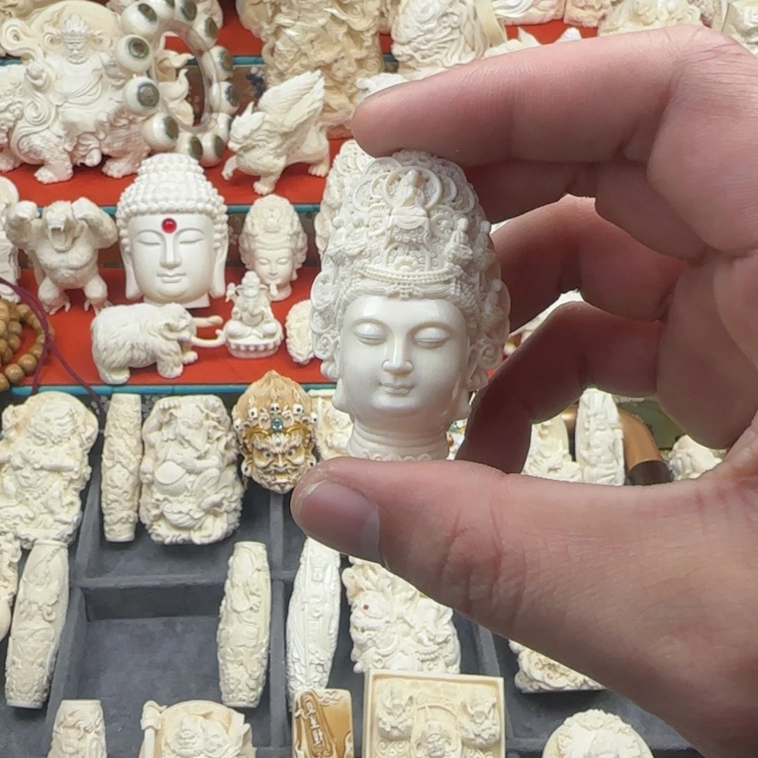 用***9猛犸牙七宝佛观音首吊坠